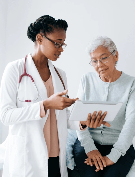 Female doctor showing report to patient